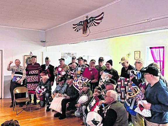 Veterans pose with the Quilts of Valor they received at the Veterans Welcome Home Day lunch, hosted by the Karen Ann Quinlan Hospice. (Photos by Maria Kovic)