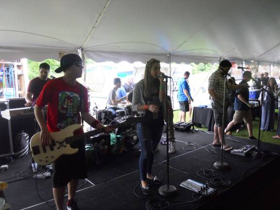 Beer, BBQ and beats Lima Bean Riot entertained guests with cover songs.