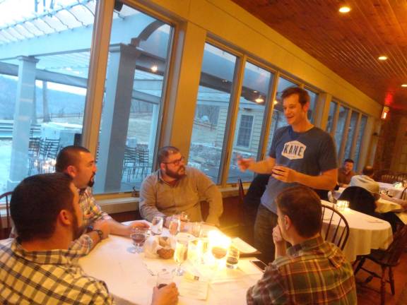 Brewery Vice President of sales Glenn Lewis, originally from Sparta, chats with a group of beer enthusiasts.