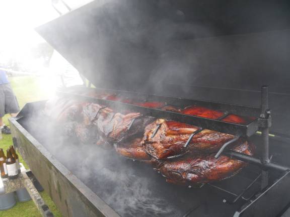 Portions of pork butt were smoked at the festival for 17 hours and then shredded for pulled pork sandwiches.