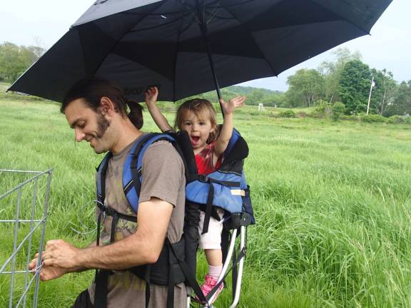 Joe's &quot;patented rain system,&quot; which he invented so he could do farm work with Kai without her getting wet.