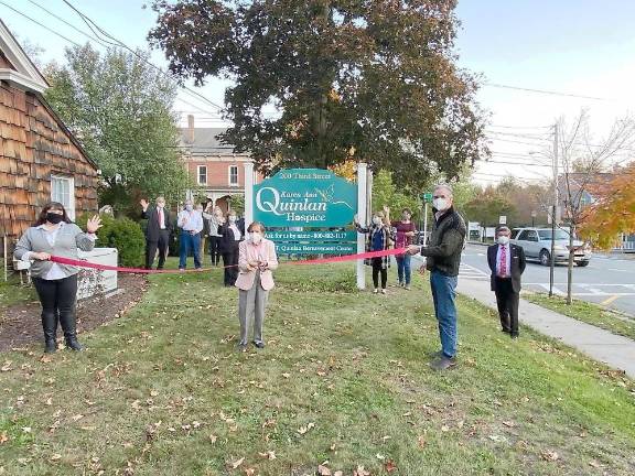 Julia Quinlan, co-founder and CEO, cuts the ribbon at the open house with Laura Quintiliani, Pike County Chamber of Commerce board member, and Milford Mayor Sean Strub