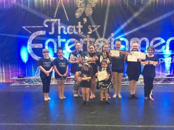 Dance academy wins numerous awards Pizazz! Elite Team on stage at That's Entertainment. Back row, from left: Samantha Barnable, Stephanie Longo, Isabella Ferreri, Devan Meggiolaro, Emily Baker, Talia Greenwood, Katie Molini, Cassidy Baker. Front row, from left: Grace Lamattina and Haydee Orr.