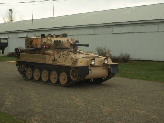 Military vehicles, troops occupy fairgrounds A British Scorpion reconnaissance vehicle