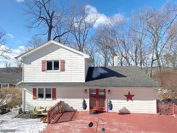 This Lake Mohawk four-bedroom home checks off all the boxes