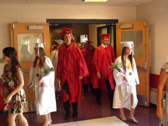 Hamburg students graduate to high school Students marching from the library to the school gymnasium.