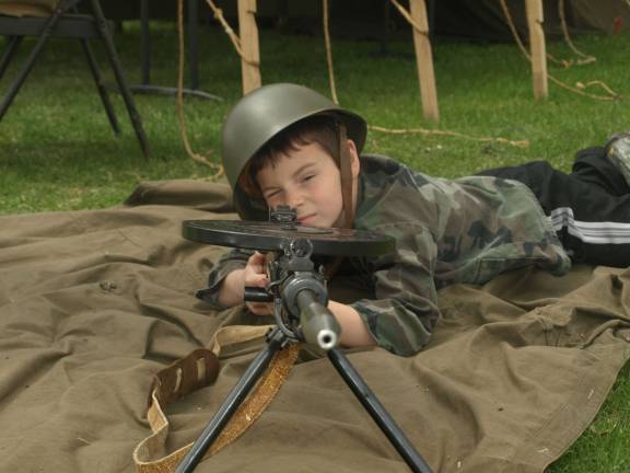 Luke Ceppler , 8, of Stillwater with a Russian GP28 machine gun.