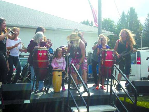 Ogdensburgers young and old join the band on the stage.