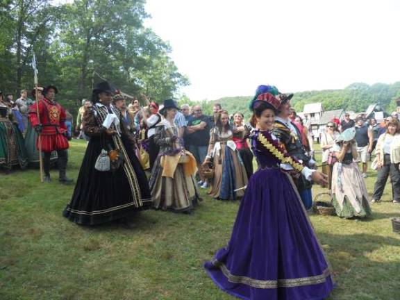 Locals perform at the Renaissance Faire Chilingerian during the Queen's Arrival performance.