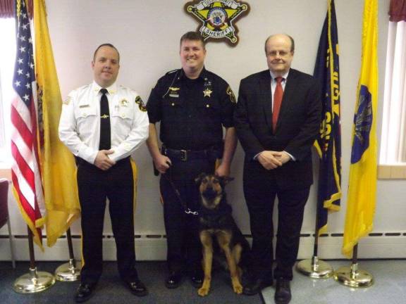Sheriff's Dept. purchases K-9 with seized drug money From left, Sheriff Michael F. Strada, Detective Kieran McMorrow, K-9 Kilo, and Prosecutor David Weaver.