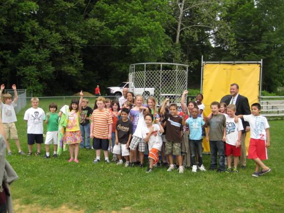 Reading challenge exceeded; time to dunk the administrators The third grade along with their soaked administrators