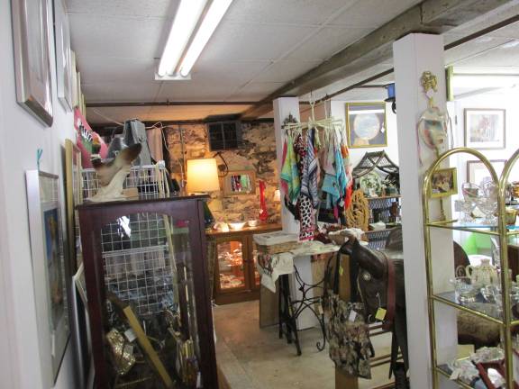 Jo Junque Antiques n' Stuff opens with celebration The store offers everything "from a 700 year old jar to a scuba suit."