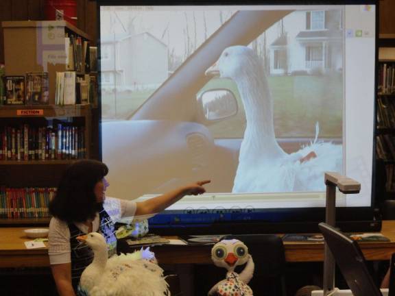 Beckmann, Oliver enthrall Franklin students Vernon children's author Leesa Beckmann shows a video of Oliver riding in the passenger seat of her car.