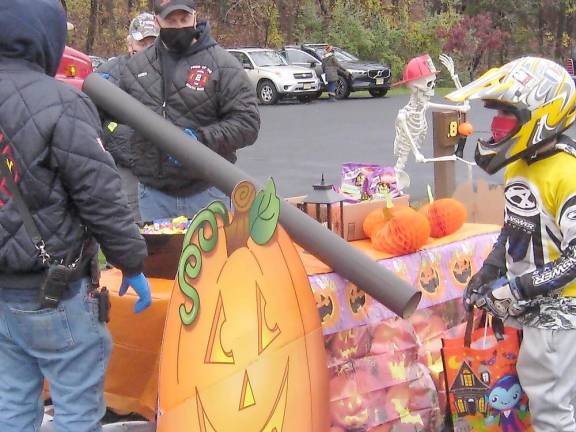 McAfee Fire Department built a no-contact tube to shoot candy into trick-or-treaters’ bags (Photo by Janet Redyke)