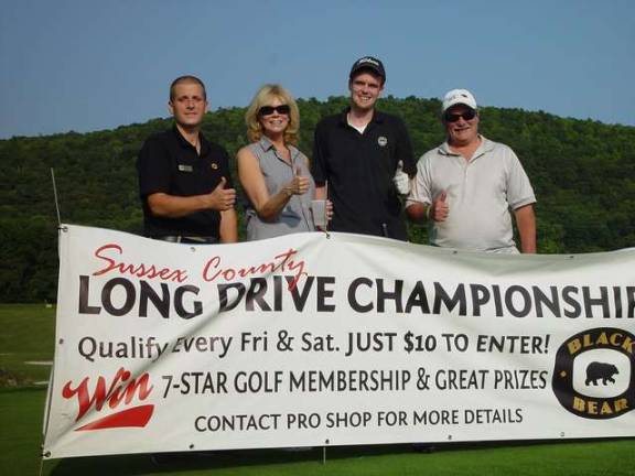 Crystal Springs Long Drive Competition is a family affair Mom Debbie and dad Jim support son J.T. Wilson in long drive event. Crystal Springs Event Coordinator Gary Griener is at left.
