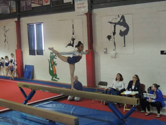 Gianna Marcos of Sparta is shown on the balance beam.