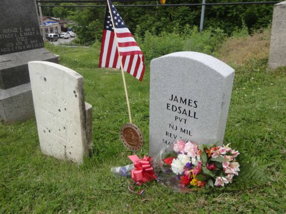 The newly dedicated headstone of James Edsall stands next to the original headstone. Photos by Scott Baker