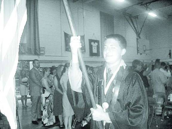 Aidan Murray was the flag bearer at the Ogdensburg eighth-grade graduation.