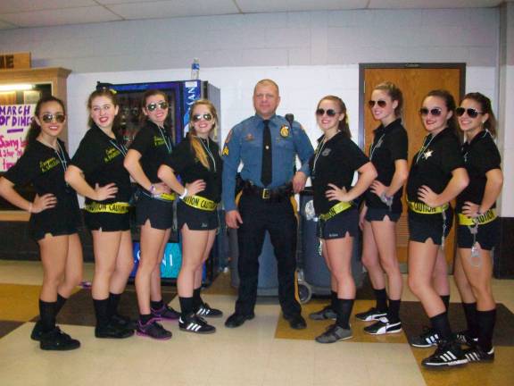 Wallkill Valley FBLA raises more than $20,000 for the March of Dimes 'The Police' surrounded Hardyston police officer Sgt. O’Rourke at Super Night 2012 on Dec. 7.