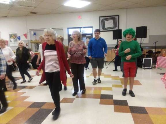 FBLA members Zach Dora (second from right) and Ricky Limon (right) showed their dance moves with local senior citizens at the circus themed FBLA Prom.