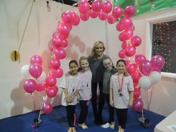 Olympian gold medalist inspires local gymnasts
