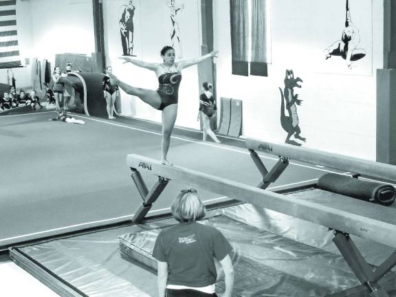 Garden Gators post successful scores in Hackettstown Rebecca Rodriguez of Stillwater is on the balance beam.