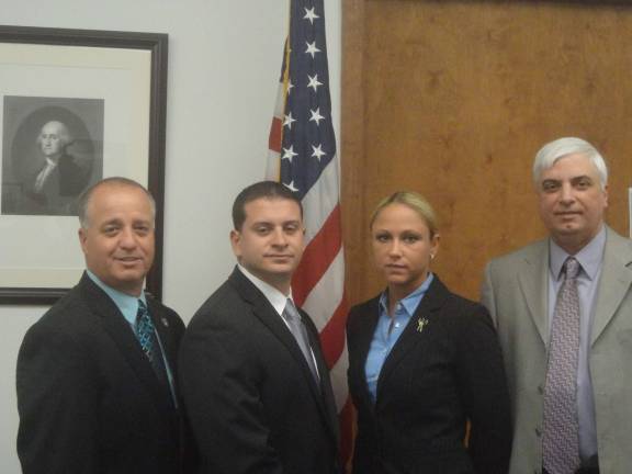 Hamburg hires new police officers From left: Civilian Police Director Wayne Yahm, Patrolman Jason Tangorra, Patrolwoman Dana Black and Mayor Paul Marino.