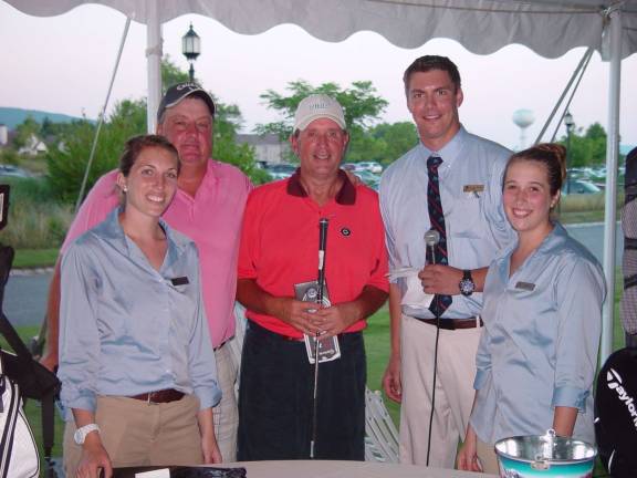 Putting contest winners Pat Egan and Fred Carballo with Crystal Springs staffers Ashley Carter, Brian Riley and Stephanie Siglin. Photo submitted by Dr. John T. Whiting
