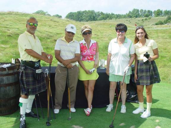 Scotch, cigar, and golf at Ballyowen Player Assistant Joe gives advice to golfers Peter Louie, Irina Ten & Buffy Whiting joined by CS staffer Ashlyn