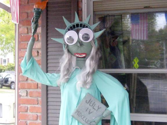 Lady Liberty stands proudly on the porch of Tri-State Flagpole and Gifts (Photo by Janet Redyke)