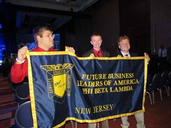 FBLA members attend conference Wallkill Valley FBLA members Kyle McKenna, Garett Koch, and Connor Mendes hold the New Jersey FBLA banner to rally New Jersey members at the 2015 National Fall Conference.