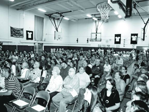 The crowd waiting for the kindergarten graduation ceremony to start.