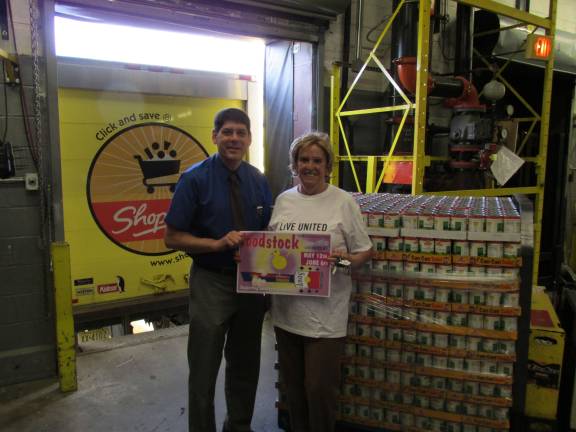 ShopRite donates canned goods to United Way John Reinhart, general store manager at Newton ShopRite, joins Mary Emilius, United Way of Northern New Jersey, to turn over the donated ShopRite canned goods