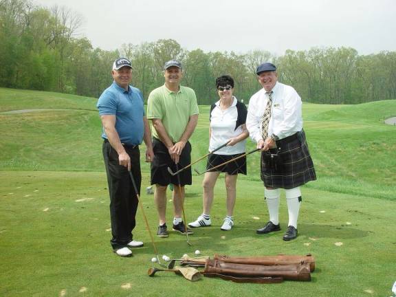 Golffest kicks off with tournaments Poto courtesy John Whiting Mark Lomauro, Jack Corcoran & Buffy Whiting get instructions on using hickory shafted 1934 golf clubs by John, Ballyowen Starter.