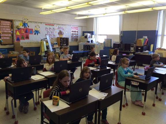 Hamburg second-graders out of this world Kimberly Ivanaov’s second-grade class working on the new laptops.