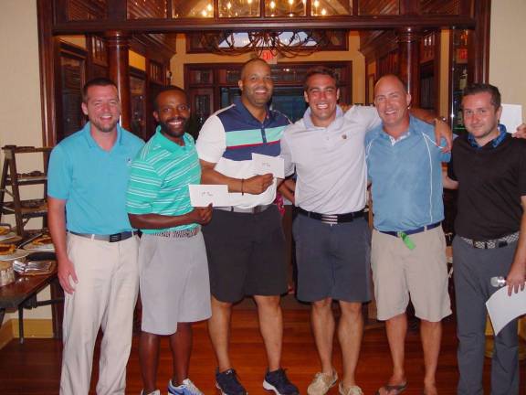 Scotch, cigar, and golf at Ballyowen The winning team of Michael Korn, Darara Dibabu, Hommy Almonte & Tanner Federico receive their awards from Event Coordinator Ryan Donley & GM Mark Melillo.