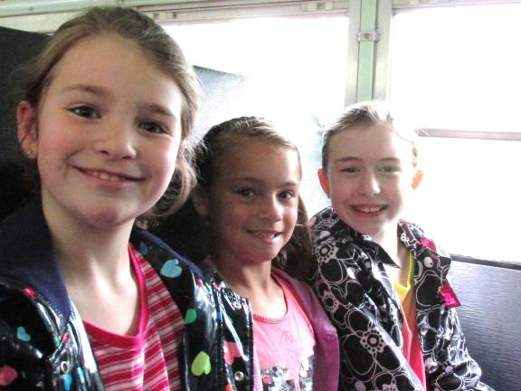 Stillwater students mine for treasures Photos by Laurie Gordon Julia St. Clair, Ashley Rose Gordon and Marah Whitby talk animatedly about the trip as the bus takes them to the museum.