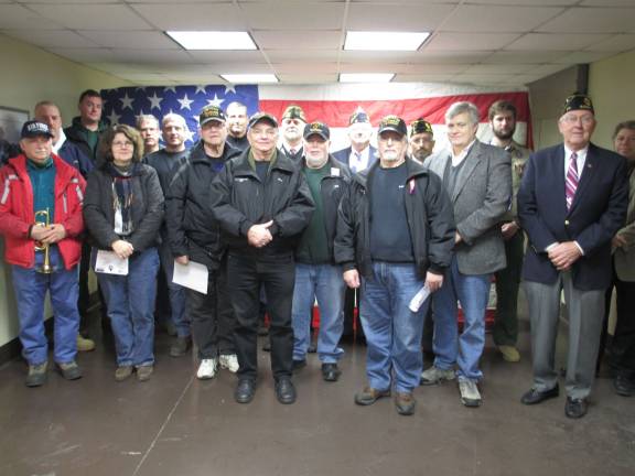 Photo by Viktoria-Leigh Wagner Veterans are shown with with Renee Casapulla, left, at the Jan. 7 flag-retirement ceremony.