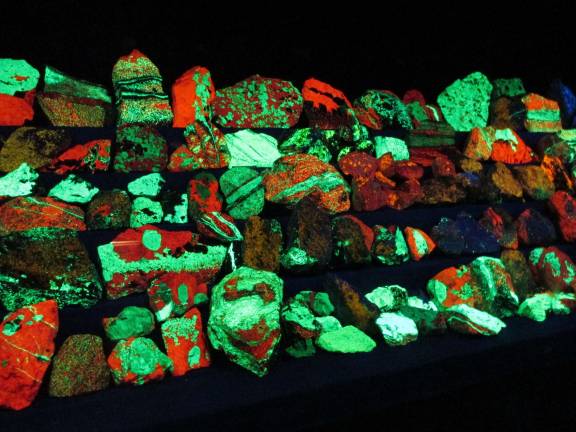 Stillwater students mine for treasures Florescent rocks.