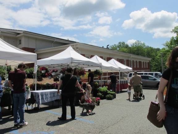 Local folks, farms and food meld together at Farmers market Locals shop at Sparta's Farmers Market.