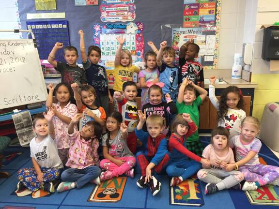 Tara Scrittore&#x2019;s kindergarten class in Hamburg School is proudly showing their &#x201c;Go Gold&#x201d; bracelets. Students were able to wear their pajamas and by donating $2 to the American Children&#x2019;s Cancer Organization they received the bracelets.