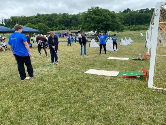 6 teams compete in Senior Olympics The golf putt competition.
