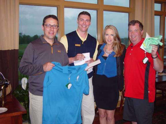 Golffest kicks off with tournaments Photo courtesy John Whiting The Mcallan Hickory Scotch Tournament Winners Shoeman and Gordon with Brian Riley and the Mcallan Girl.