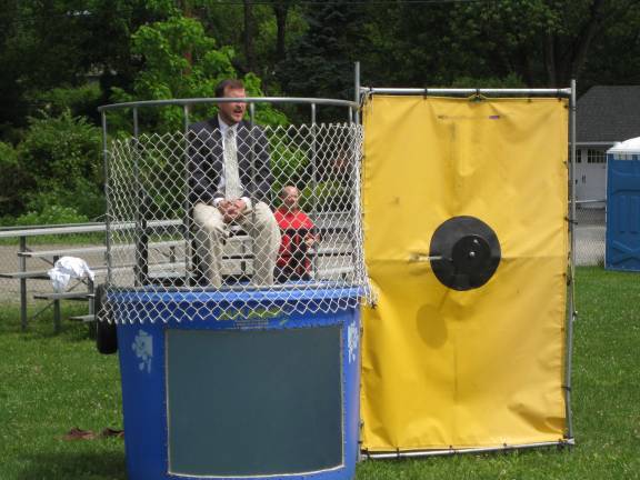 Reading challenge exceeded; time to dunk the administrators Superintendent Roger Jinks awaits a dunking.