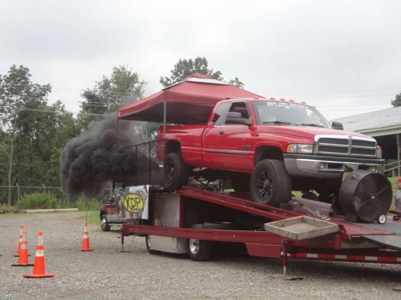 Noisy fundraiser helps firefighters Randolph volunteer fireman Louis Amaducci has his 2001 Dodge Ram 2500 run on the dynomometer. PHOTO by Scott Baker