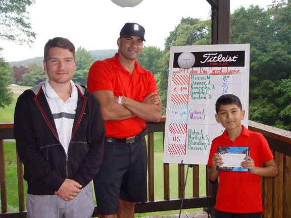 Connor Gamble and his dad accept the prize for K-4 Division presented by Minerals GC Event Coordinator Nick VanDerlofske.