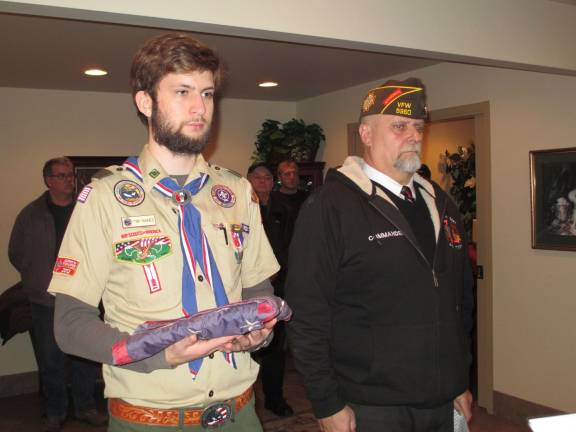 Photo by Viktoria-Leigh Wagner Eagle Scout Tim Haines, 20, of Newton is shown with Veterans of Foreign Wars Newton Post Commander Frank Smith participating in the flag-retirement ceremony on Jan. 7.