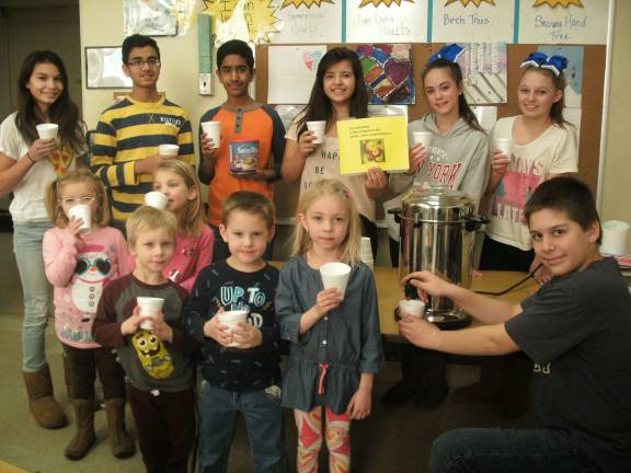 Students shown are: in back, Olivia Biddulph, Abhishek Patel, Harshill Bhavsar, Ashley Matzko, Julianna Hood, Alyssa VanderPloeg; middle row, Emily Postas, Ashley Pauciello; and front row, Ian Webb, Michael Walters, Isabella Lorenc. Hot chocolate was served by NJHS member Peter Paszkiel.