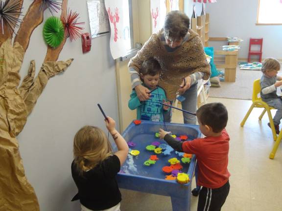 Youngsters take some time to fish at Great Beginnings' annual Day of the Young Child celebration.