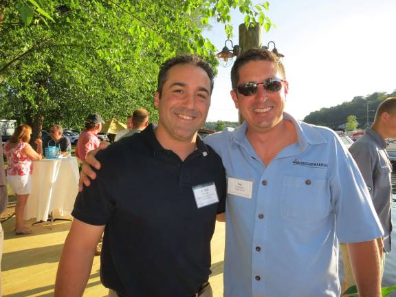 Networking event planned in Lake Hopatcong Jefferson Township Chamber of Commerce president Dr. Bret Hartman of Family Chiropractic Center of Lake Hopatcong, left, and Bridge Marina owner and Chamber member Ray Fernandez enjoy an evening of connections, cocktails and cruises at last yearþÄôs þÄúNetwork on Lake HopatcongþÄù event. Hartman and Fernandez will host the 8th Annual Network on Lake Hopatcong event on June 25, 2015 from 6-8 p.m. at Bridge Marina in Lake Hopatcong.